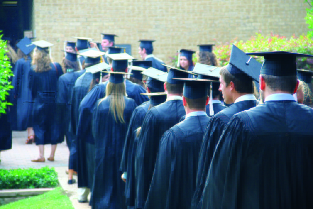 Soon-to-be graduates line up outside of the Maher Athletic Center in 2013. The class of 2015 will soon be doing the same as commencement exercises get closer. -Photo by Rebecca Rosen 